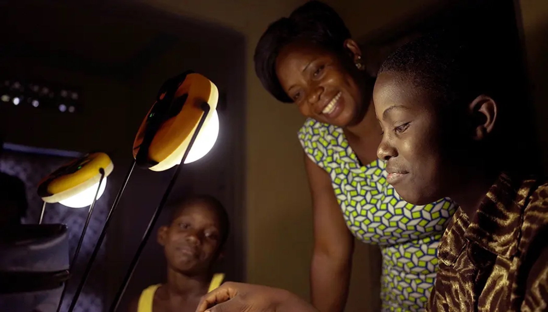 Family in Uganda using BrightLife solar lamps at home